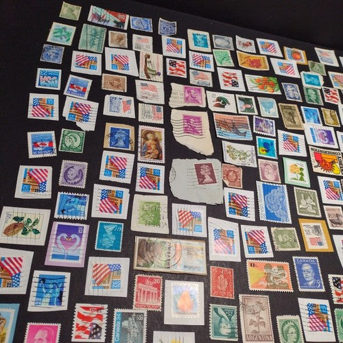 Vintage International Stamp Lot (H1) -Mixed On/Off Paper (US, Spain, Canada, +)